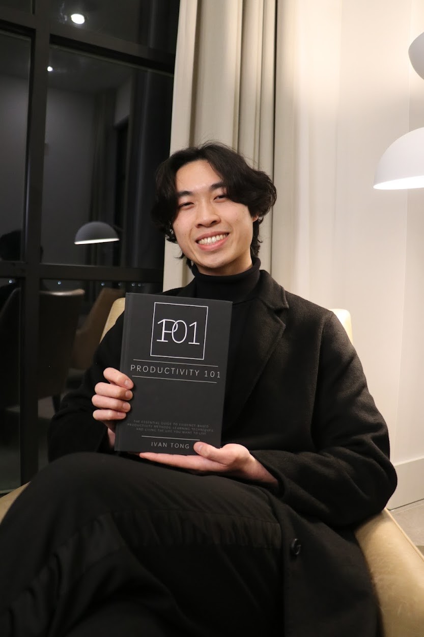 Ivan Tong holding his book Productivity 101
