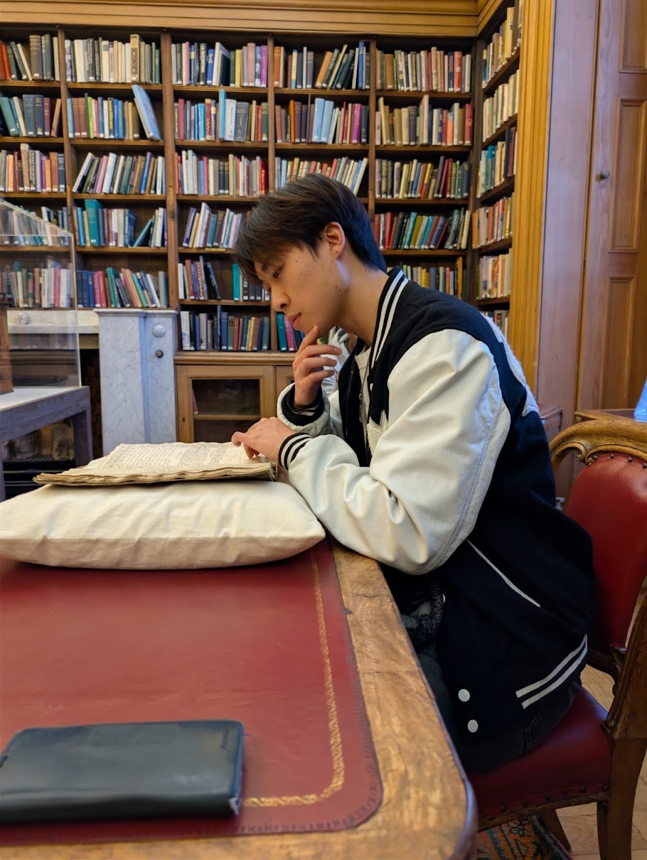 Ivan reading in a historic library